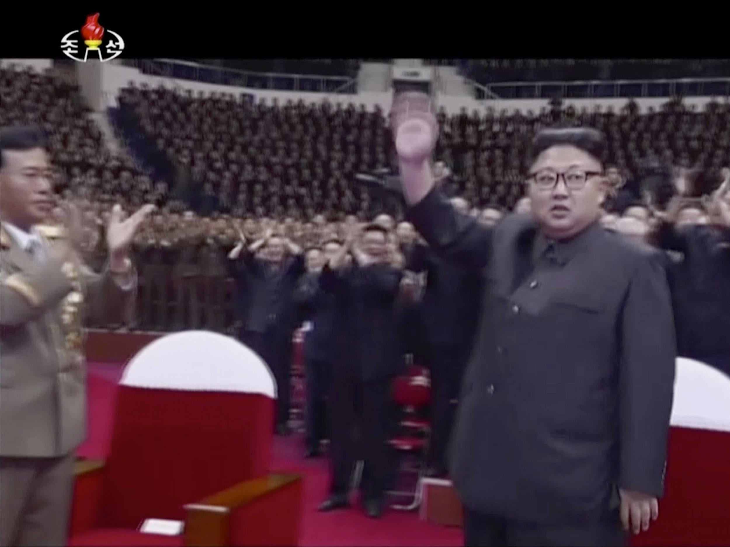 Kim Jong-un waves to the audience in Pyongyang