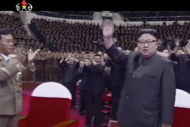 Kim Jong-un waves to the audience in Pyongyang