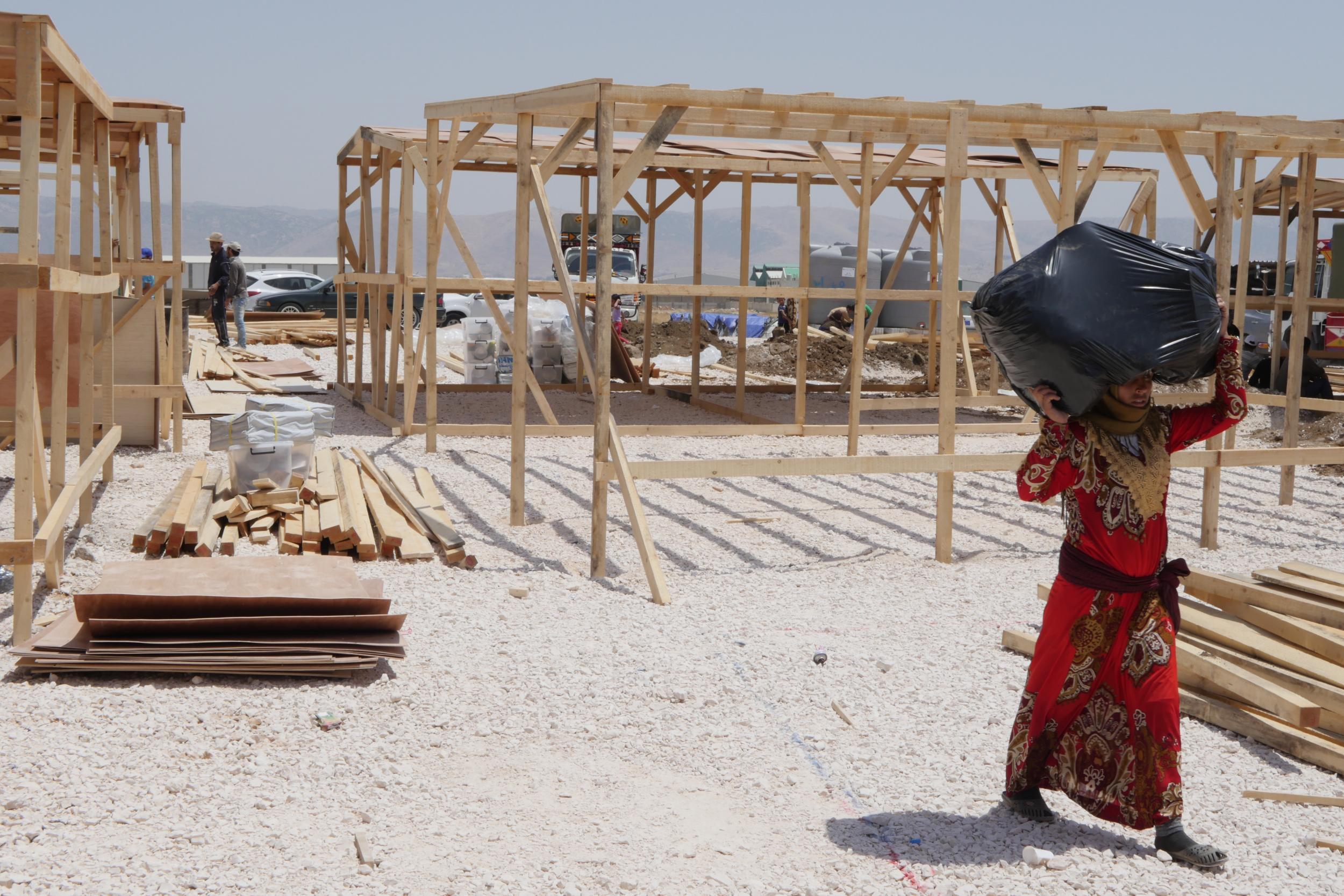 &#13;
Qab Elias refugee camp, destroyed last week, is a scene of intense activity despite the blazing summer sun &#13;