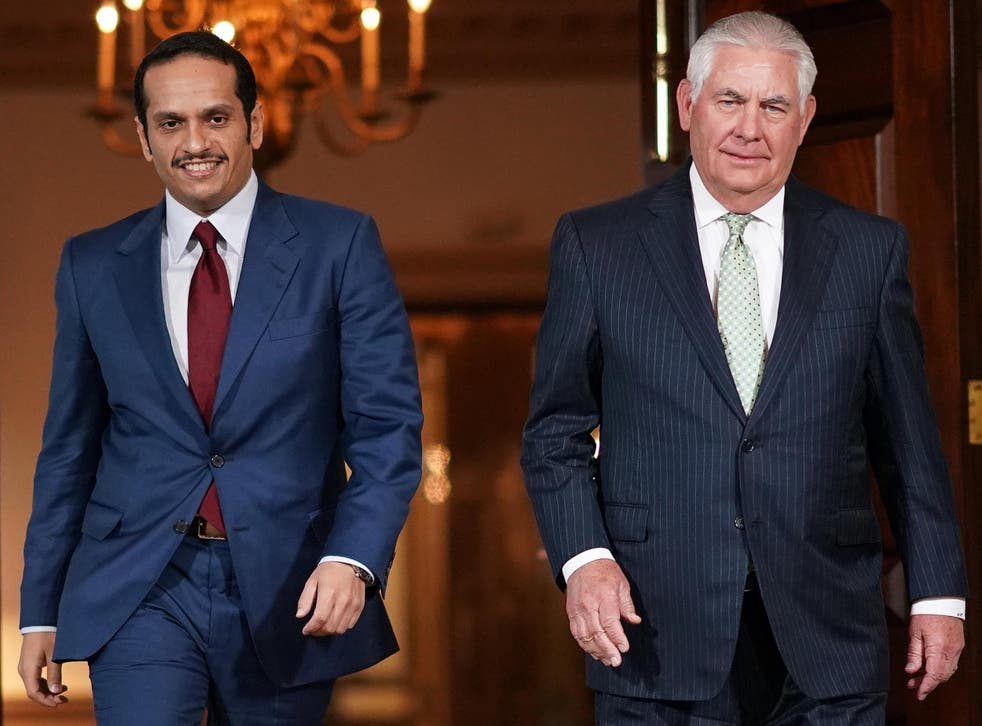 U.S. Secretary of State Rex Tillerson escorts Qatari Foreign Minister Sheikh Mohammed Bin Abdulrahman Al Thani prior to a scheduled meeting at the State Department