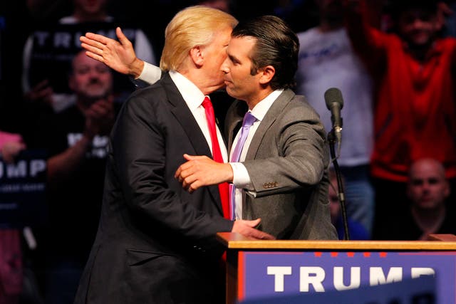 Donald Trump Jr. hugs his dad  Donald Trump after addressing the crowd during a campaign rally at the Indiana Farmers Coliseum on April 27, 2016