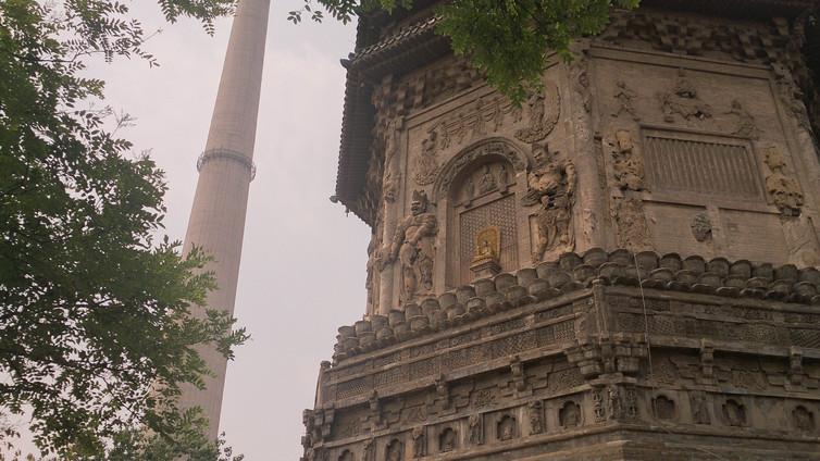 The Liao period Tianning Temple Pagoda in Beijing, with an industrial chimney in the background