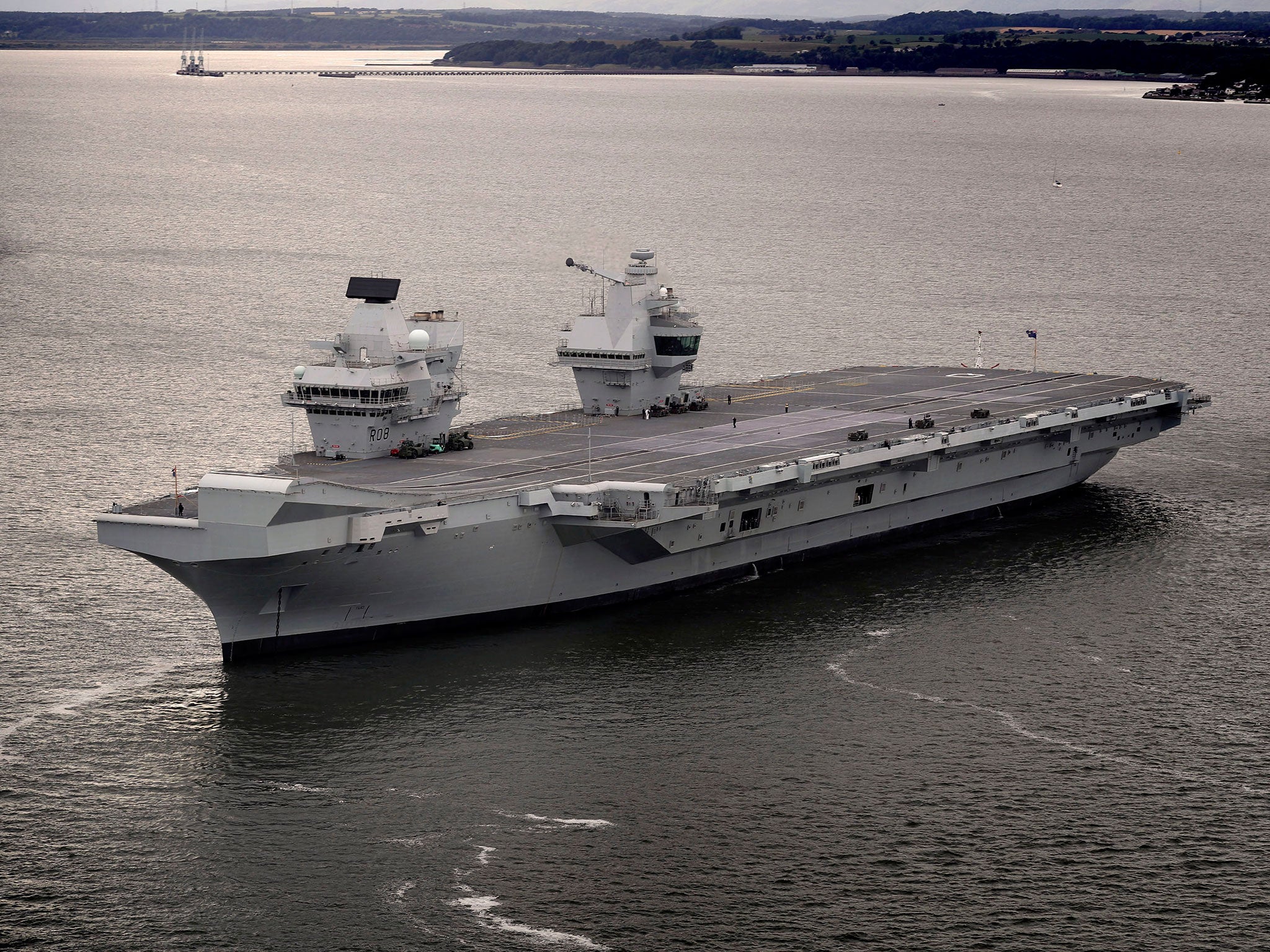 HMS Queen Elizabeth, one of two new aircraft carriers for the Royal Navy, leaving the Rosyth dockyard near Edinburgh to begin her sea worthiness trials on 26 June