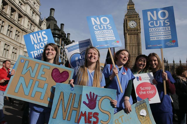 Protesters at a demonstration against cuts to NHS funding in central London