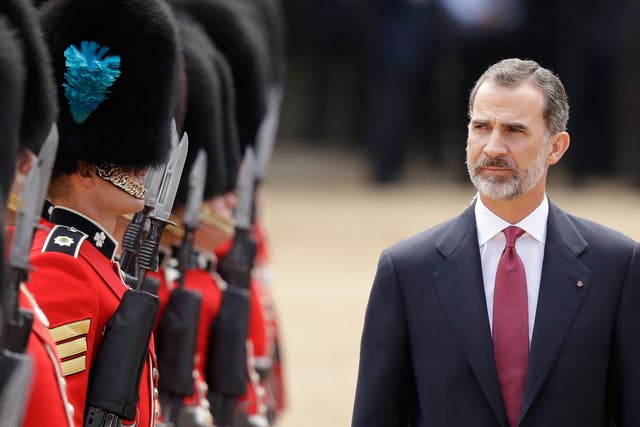 King Felipe inspects a guard of honour during a Ceremonial Welcome on Horse Guards Parade