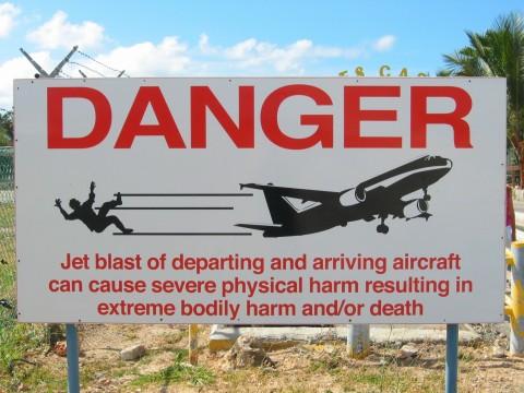 Large danger signs around the airport have become popular selfie spots