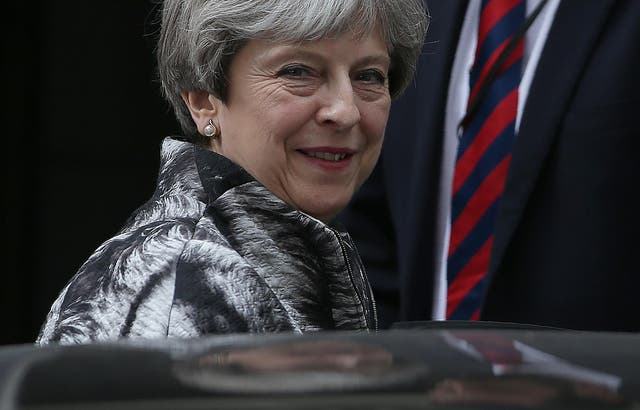 Theresa May leaves her first Cabinet meeting following the general election result