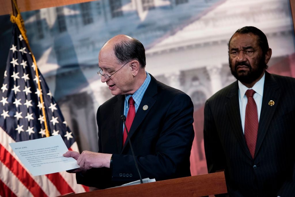 Brad Sherman, left, pictured with fellow Democratic congressman Al Green, said his party could help save the Speaker – as long as Gaza aid was on the table