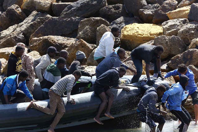Illegal migrants from Africa arrive on shore after being rescued by Libyan coast guards