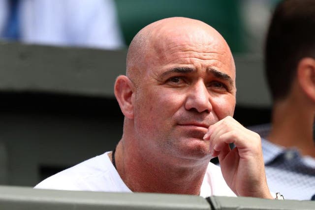 Andre Agassi, coach of Novak Djokovic, watches on during an earlier game at Wimbledon