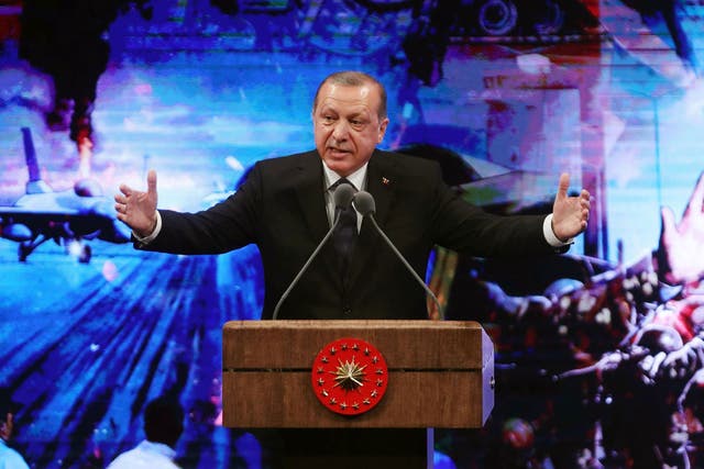 Turkish President Recep Tayyip Erdogan speaks during a ceremony in Ankara marking last year’s failed coup