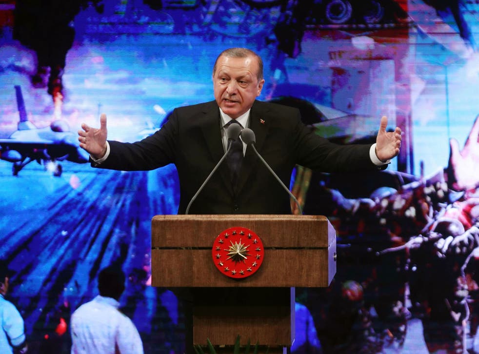 Turkish President Recep Tayyip Erdogan speaks during a ceremony in Ankara marking last year’s failed coup
