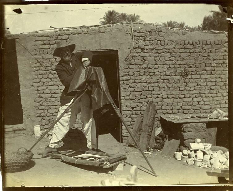 Flinders Petrie in the field documenting recently excavated artefacts, c1900