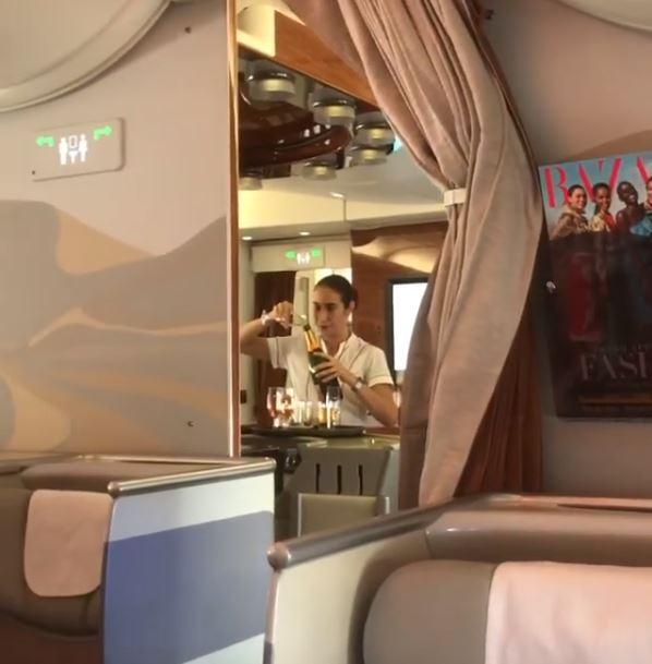 Footage has emerged of an Emirates stewardess pouring Champagne back into the bottle