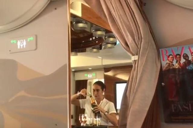 Footage has emerged of an Emirates stewardess pouring Champagne back into the bottle