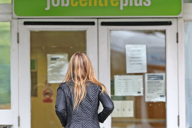 A woman walks into a job centre