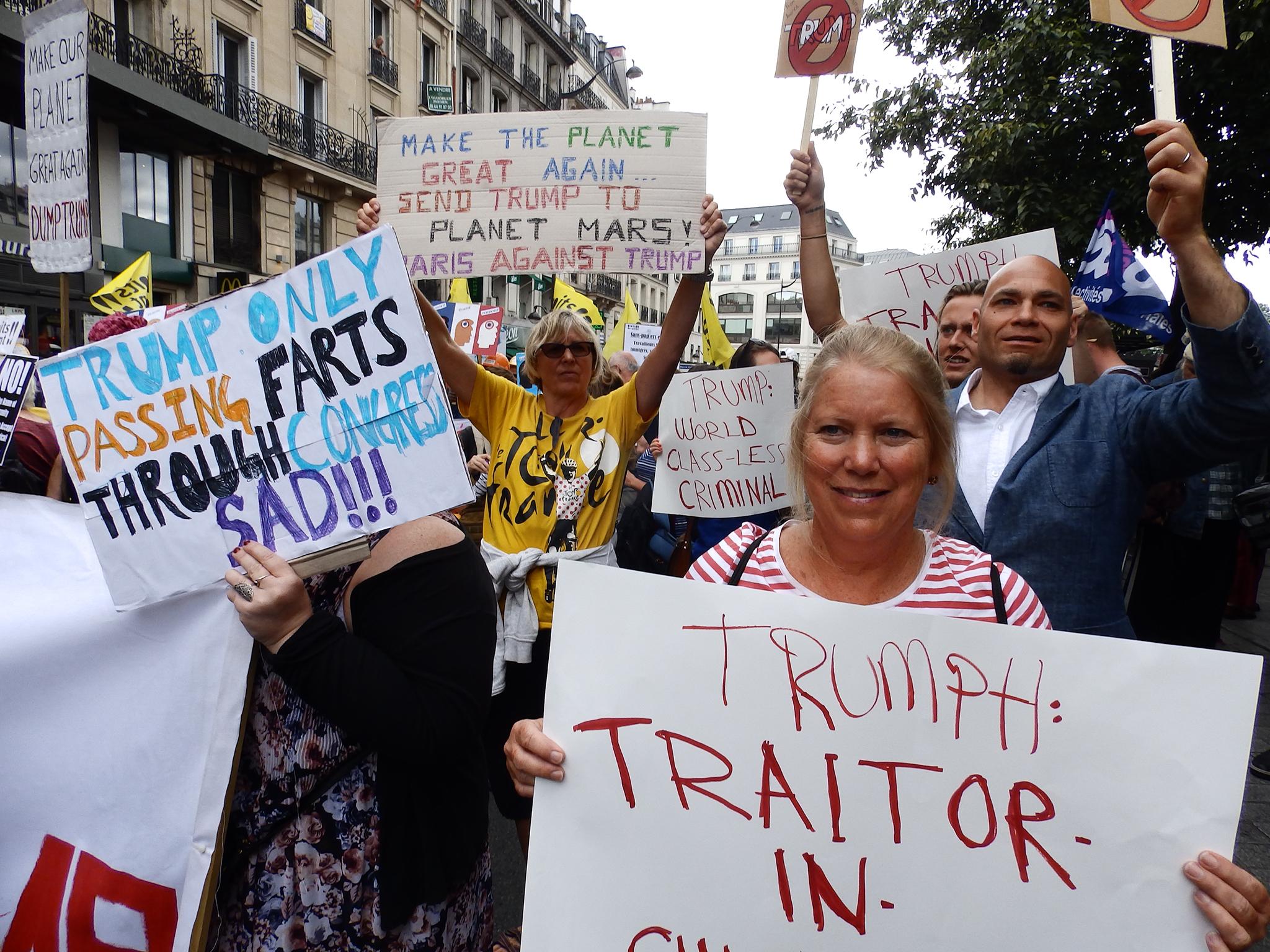 Protesters from the Droits Devant migrants' rights group at a Bastille Day march in Paris on 14 July 2017