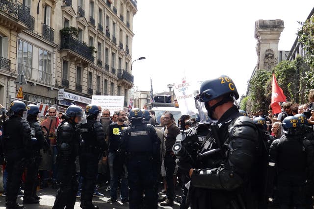 Gendarmes hold back protesters near Paris’s Gare du Nord station