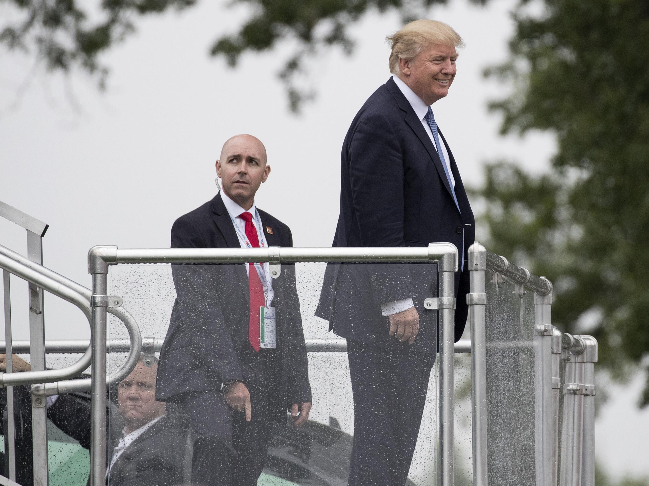 President Trump smiles at crowds at the US Women's Open, hosted at his Trump National Golf Club in New Jersey