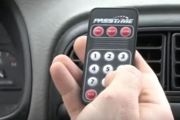 Drivers use a remote control to enter a code with keeps their car running