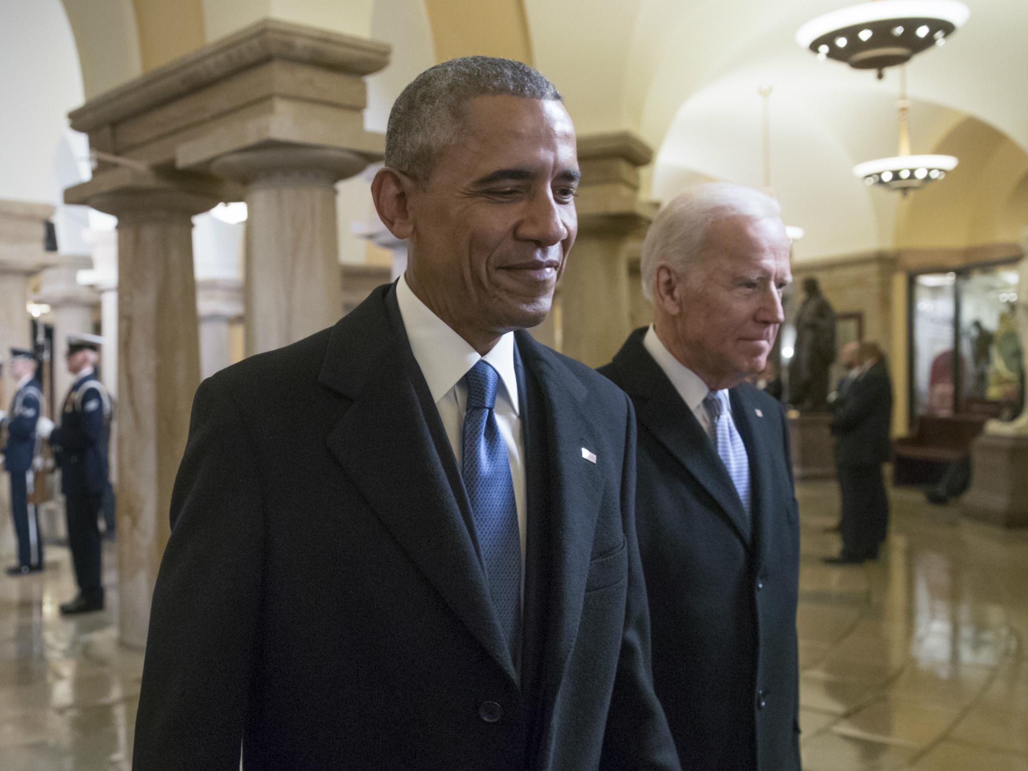 President Barack Obama and Vice President Joe Biden walk through the Crypt of the Capitol for Donald Trump's inauguration ceremony, in Washington 20 January 2017