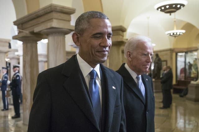  President Barack Obama and Vice President Joe Biden walk through the Crypt of the Capitol for Donald Trump's inauguration ceremony, in Washington 20 January 2017