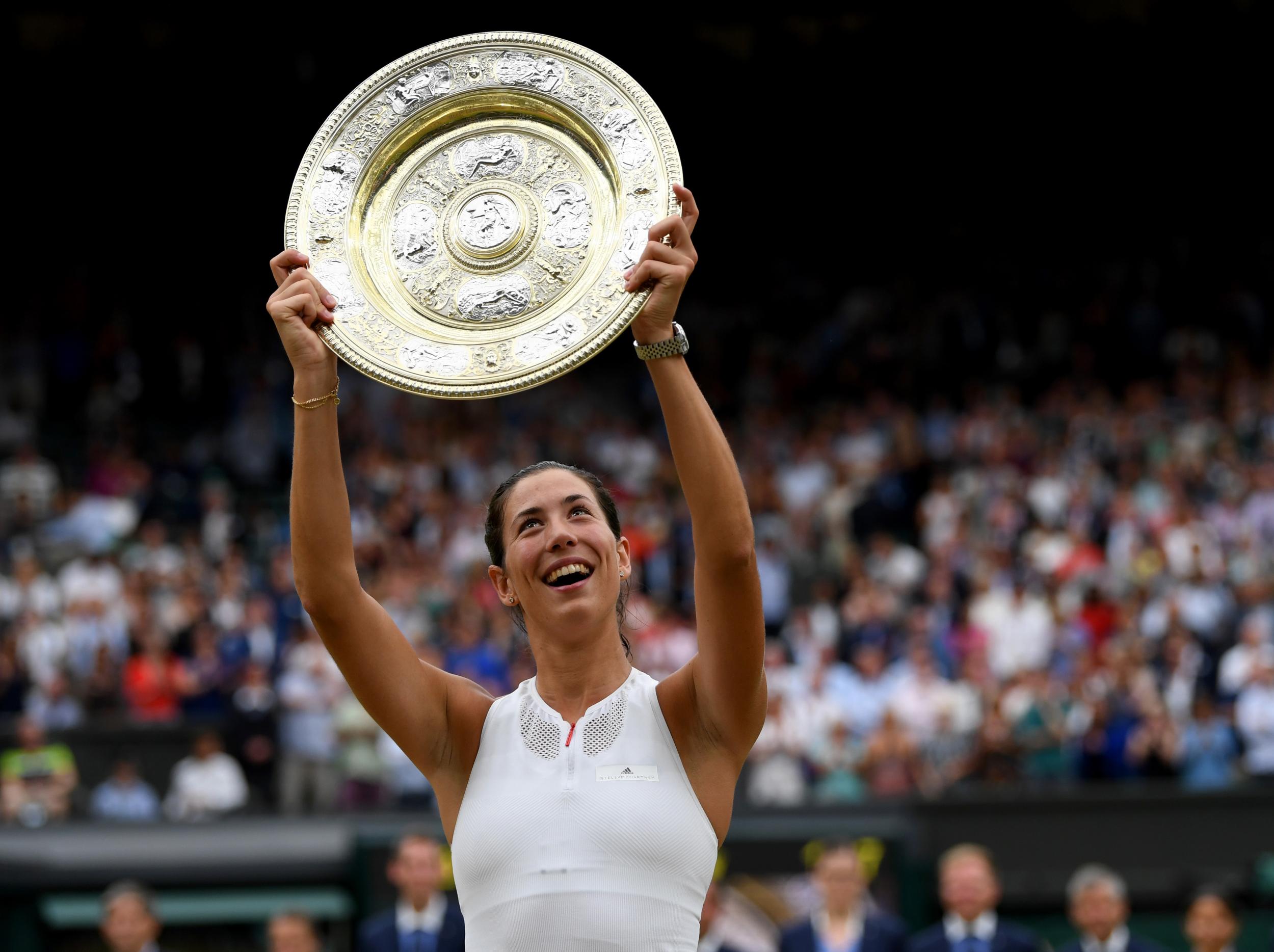 Muguruza celebrates after her win