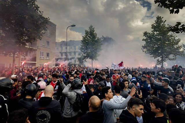Fans gather outside of the home of Dutch midfielder Abdelhak Nouri on July 14, 2017 in Amsterdam. 
Ajax Amsterdam's football player Abdelhak Nouri was diagnosed with 'serious and permanent brain damage' after collapsing on July 8 during a practice match against Werder Bremen. / AFP PHOTO / ANP / Robin van Lonkhuijsen / Netherlands OUTROBIN VAN LONKHUIJSEN/AFP/Getty Images