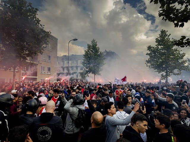 Fans gather outside of the home of Dutch midfielder Abdelhak Nouri on July 14, 2017 in Amsterdam. 
Ajax Amsterdam's football player Abdelhak Nouri was diagnosed with 'serious and permanent brain damage' after collapsing on July 8 during a practice match against Werder Bremen. / AFP PHOTO / ANP / Robin van Lonkhuijsen / Netherlands OUTROBIN VAN LONKHUIJSEN/AFP/Getty Images