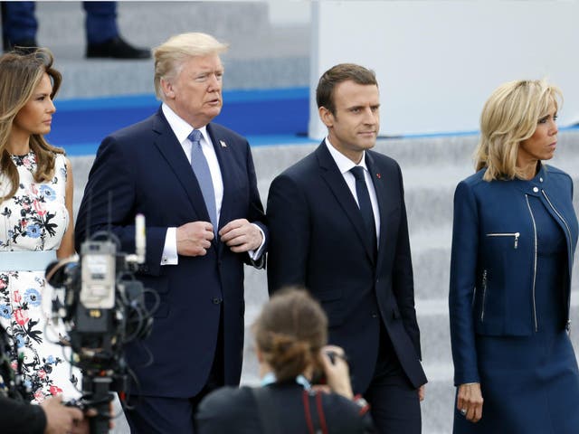Donald Trump and his wife Melania Trump, French President Emmanuel Macron and his wife Brigitte Trogneux attend the traditional Bastille day military parade on the Champs-Elysees on 14 July 2017