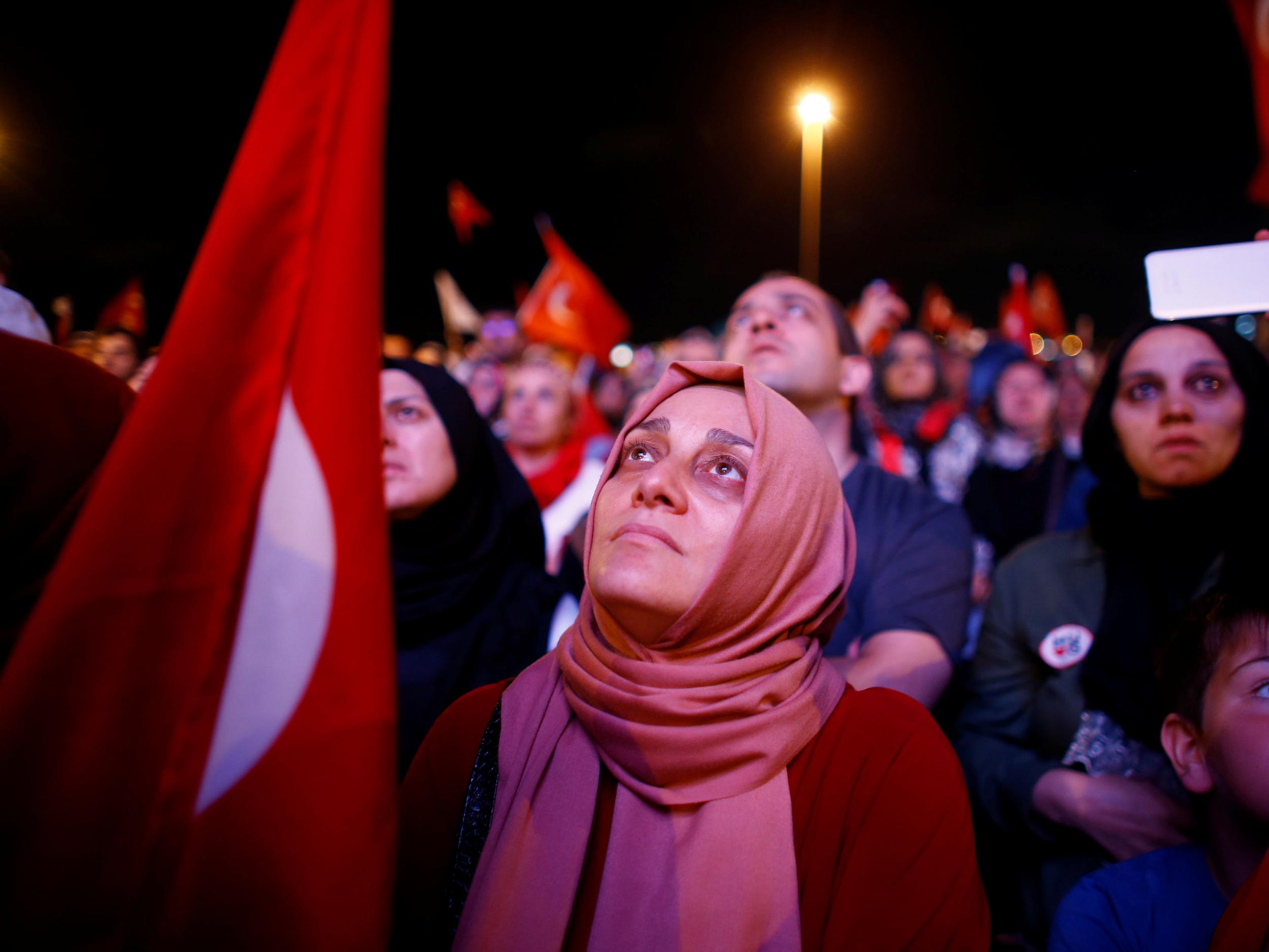 Onlookers at a rally on the anniversary of the failed coup
