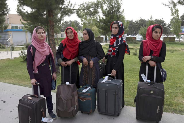 Members of the female robotics team arrive from Herat province to receive visas from the US  embassy, at the Hamid Karzai International Airport, in Kabul, Afghanistan