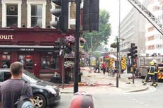 Police shut busy central London street after fire breaks out above pub