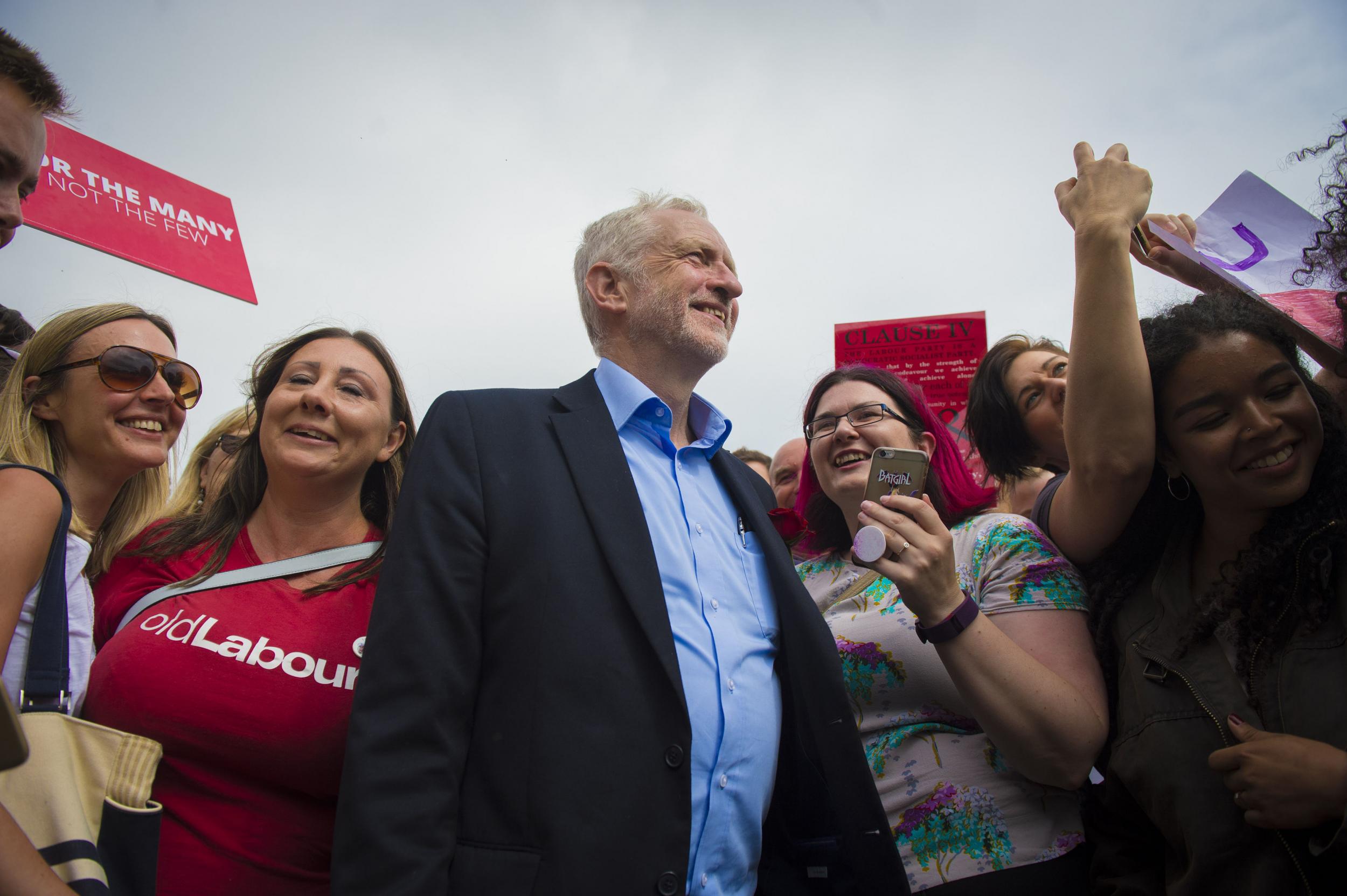 Jeremy Corbyn is greeted by supporters as he visits the West Cliff area of Bournemouth