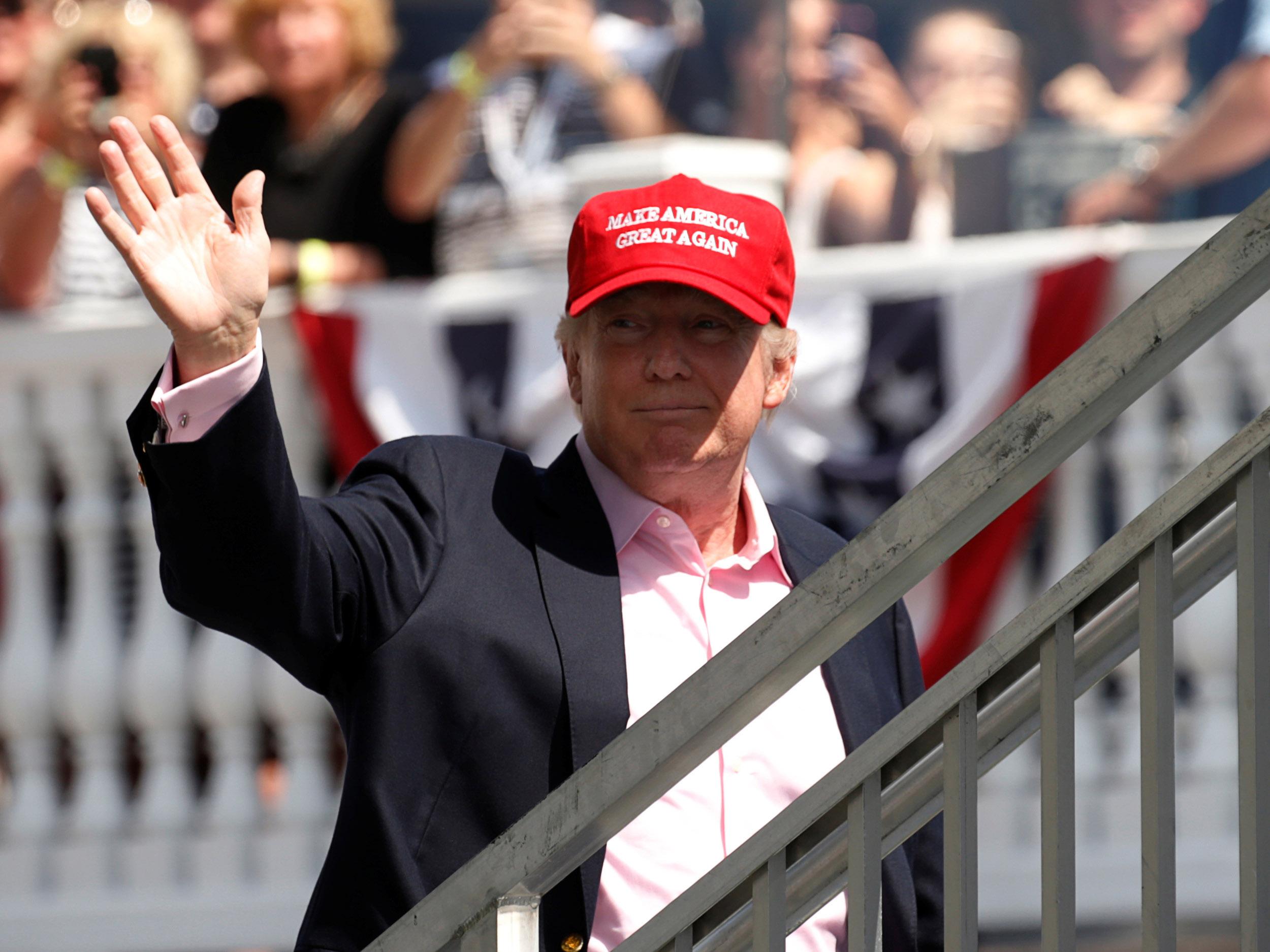 US President Donald Trump waves to supporters