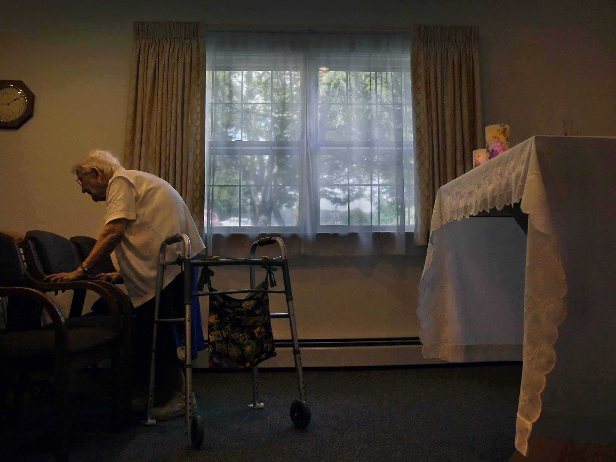
Sister Mary John Goles prepares to leave the chapel after a prayer service at the house where several nuns live 