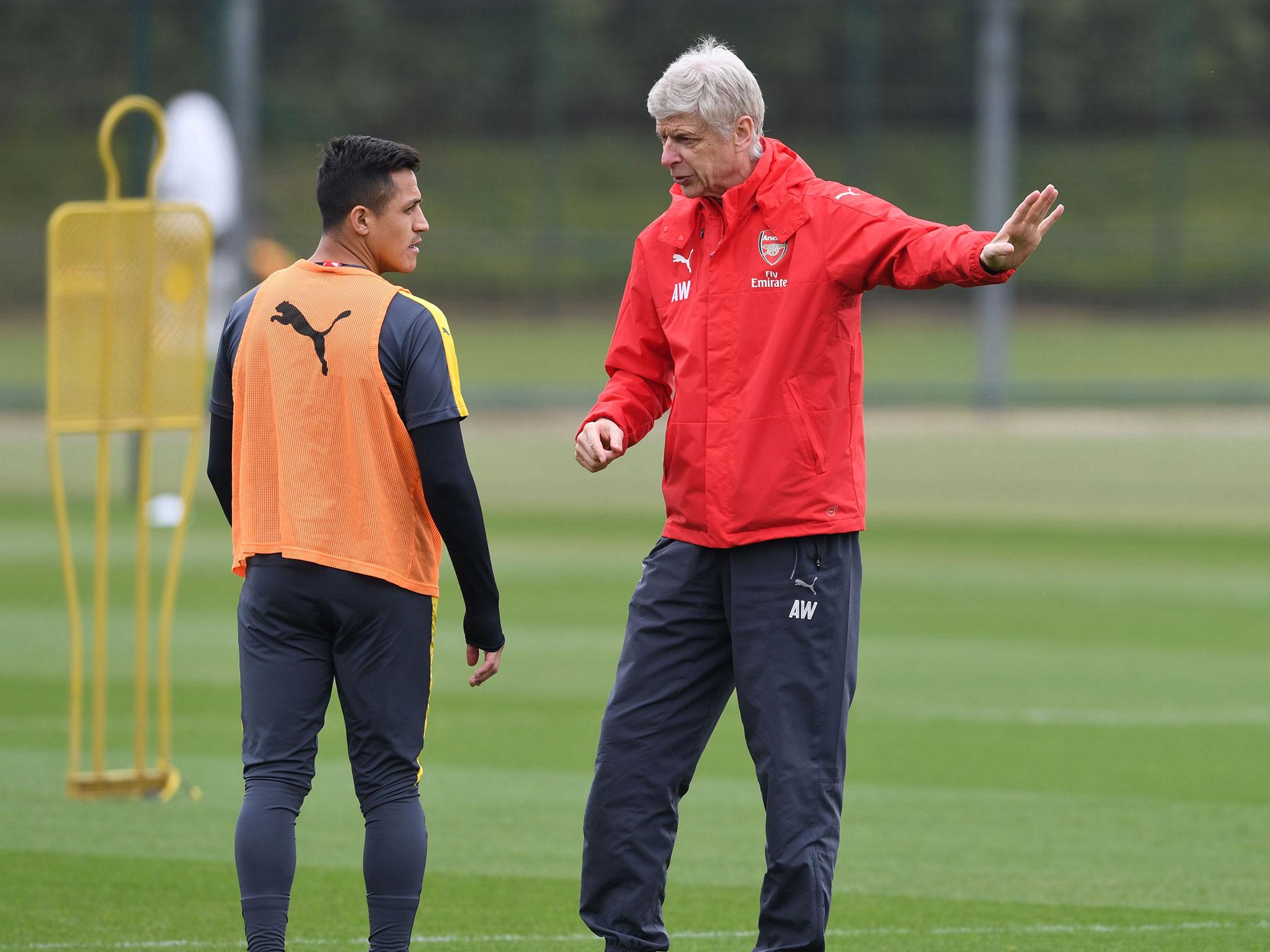 Arsene Wenger and Alexis Sanchez in training together