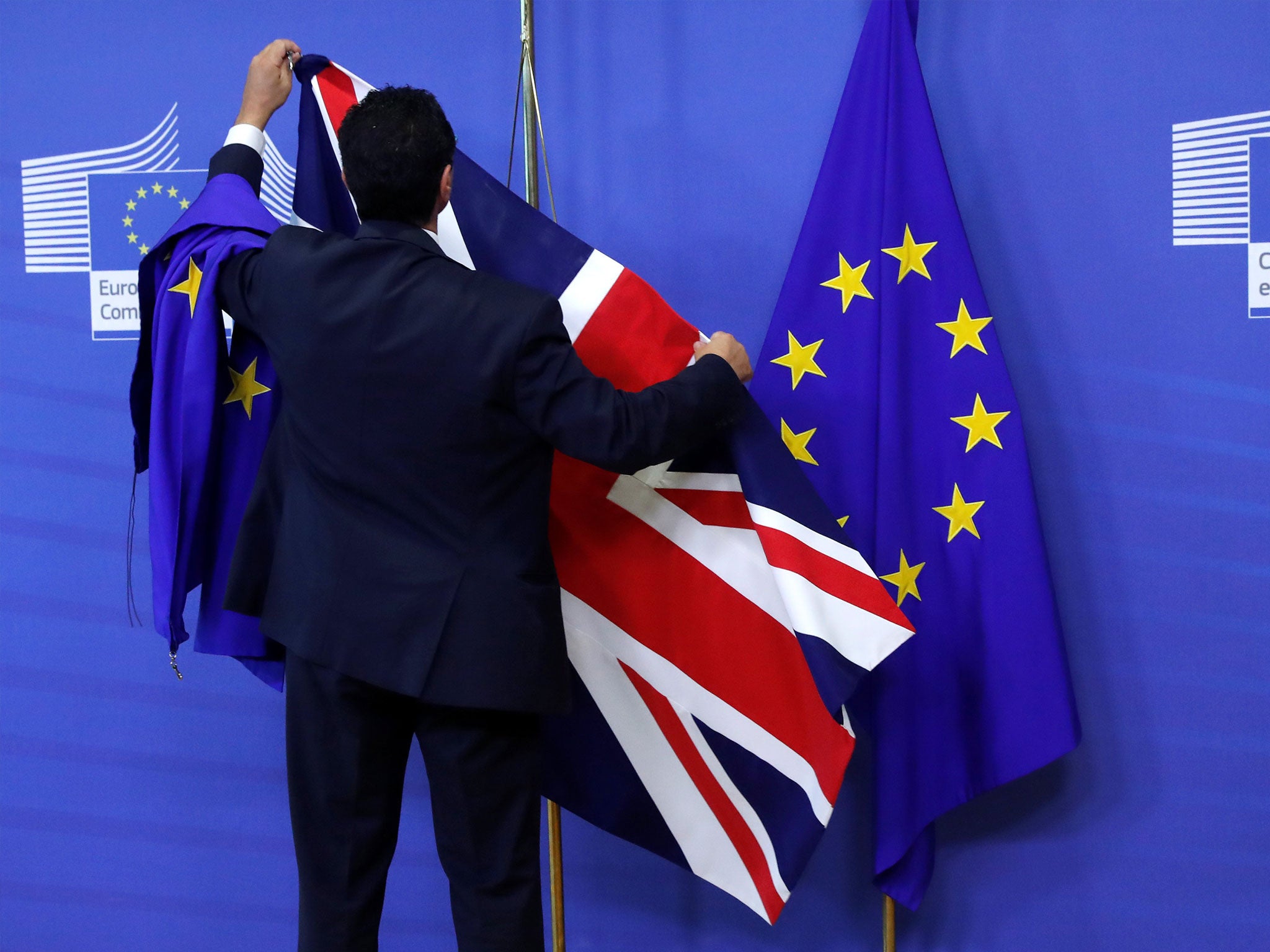 Flags are arranged at the EU Commission headquarters ahead of a first full round of talks on Brexit