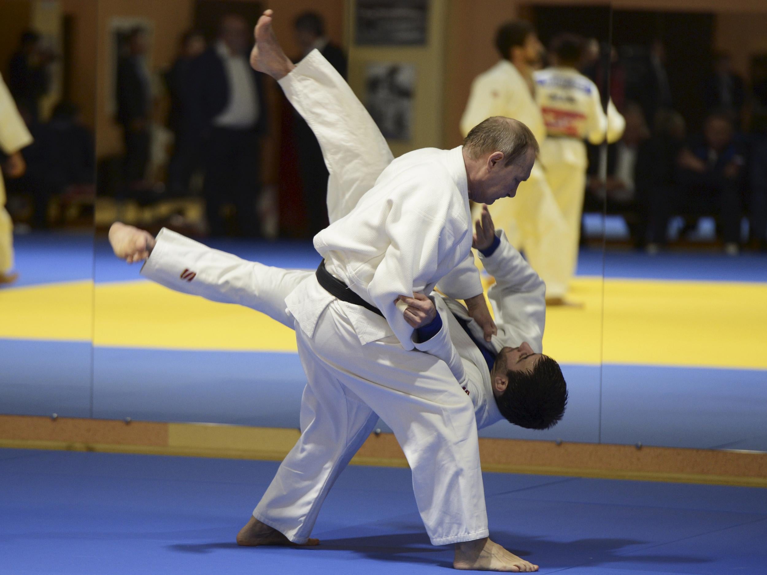Vladimir Putin takes part in a training session with members of the Russian national judo team in Sochi on 8 January 2016
