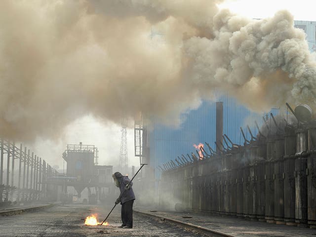 A labourer works at a coking plant in Changzhi, Shanxi province, China