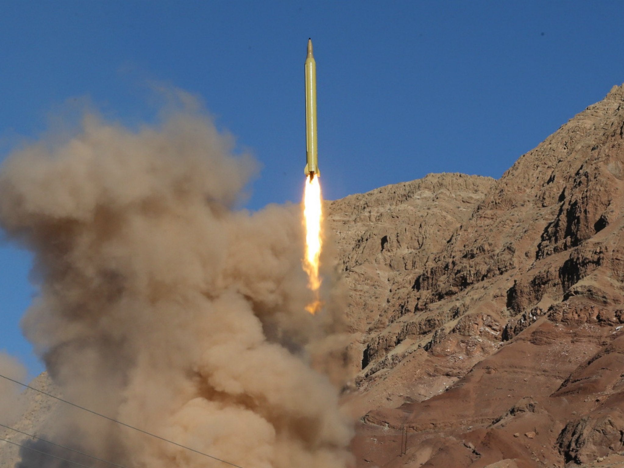 A long-range Qadr ballistic missile is launched in the Alborz mountain range in northern Iran