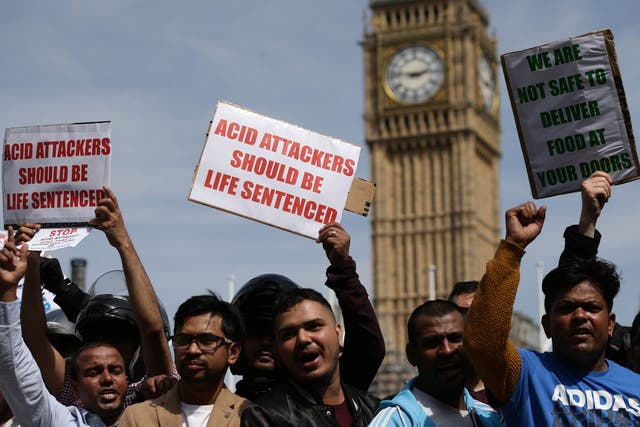Delivery drivers protest the recent spike in acid attacks in Parliament Square