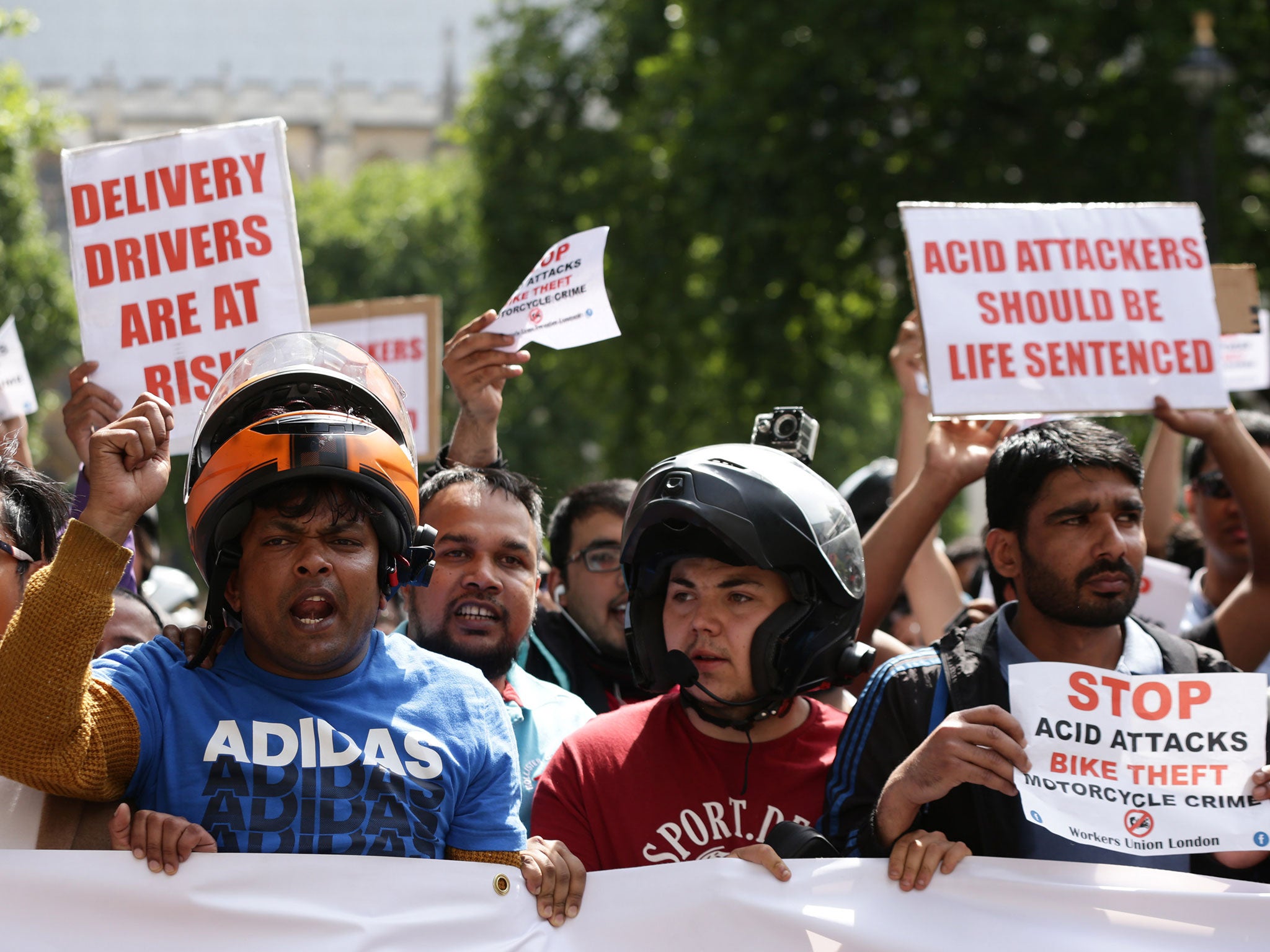 Delivery riders during a demonstration in Parliament Square on 18 July