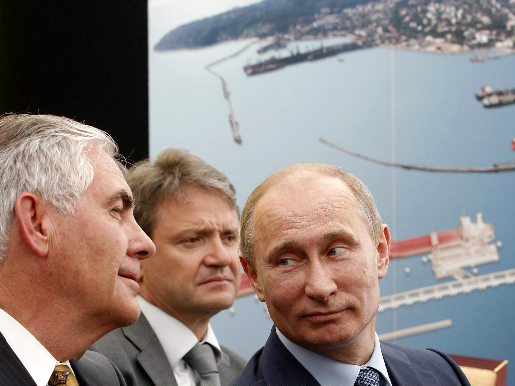 Russia's President Vladimir Putin (R) and ExxonMobil Chairman and CEO Rex Tillerson (L) attend at the ceremony of the signing of an agreement between state-controlled Russian oil company Rosneft and ExxonMobil in June 2012