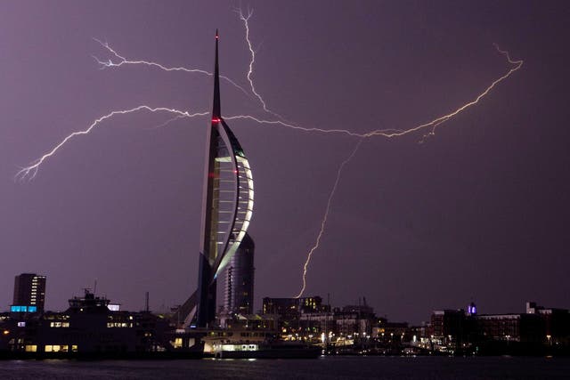 Lightning flashes near the Spinnaker Tower in Portsmouth as overnight thunderstorms swept across Britain