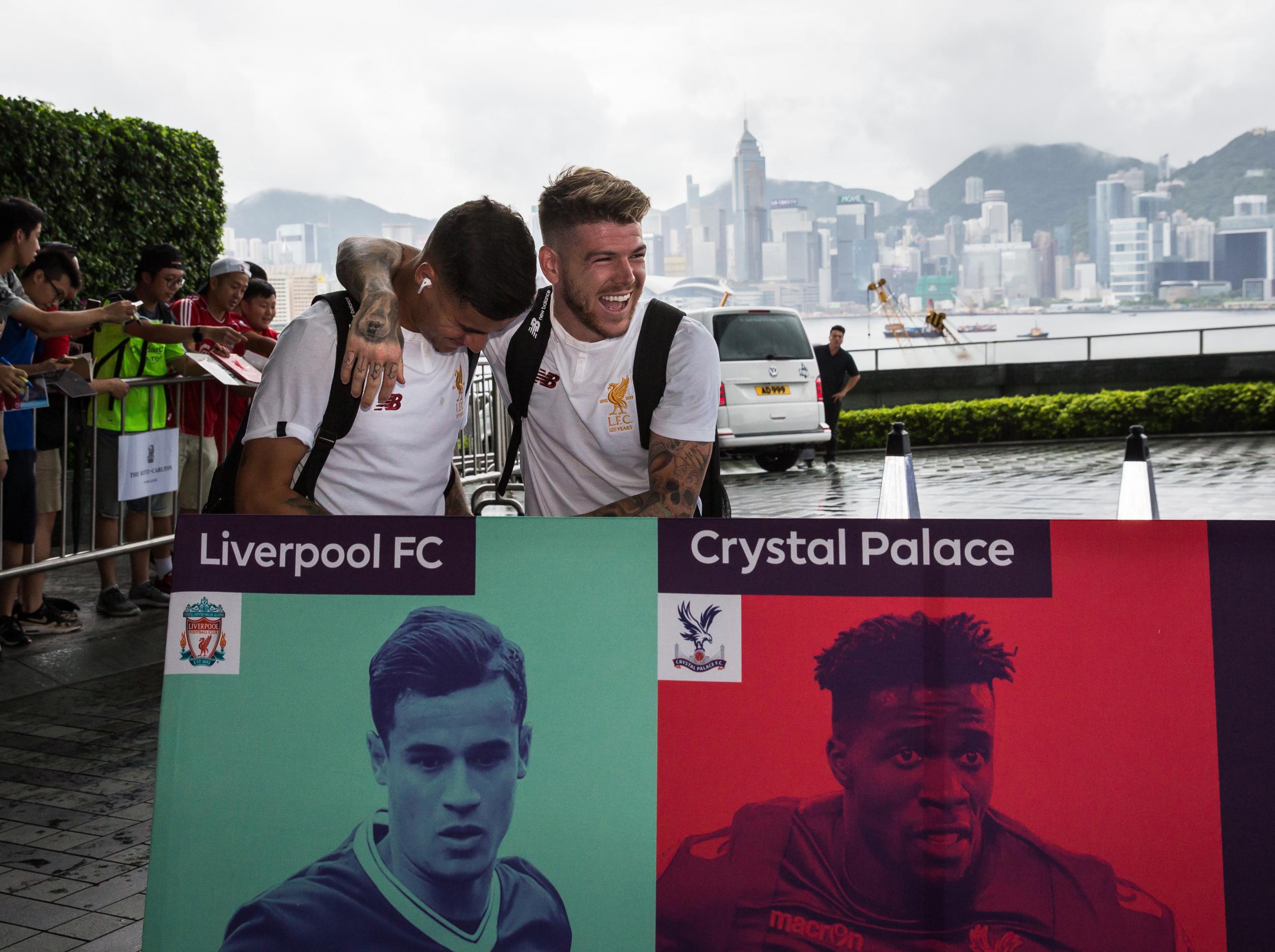 Alberto Moreno and Philippe Coutinho arrive in Hong Kong