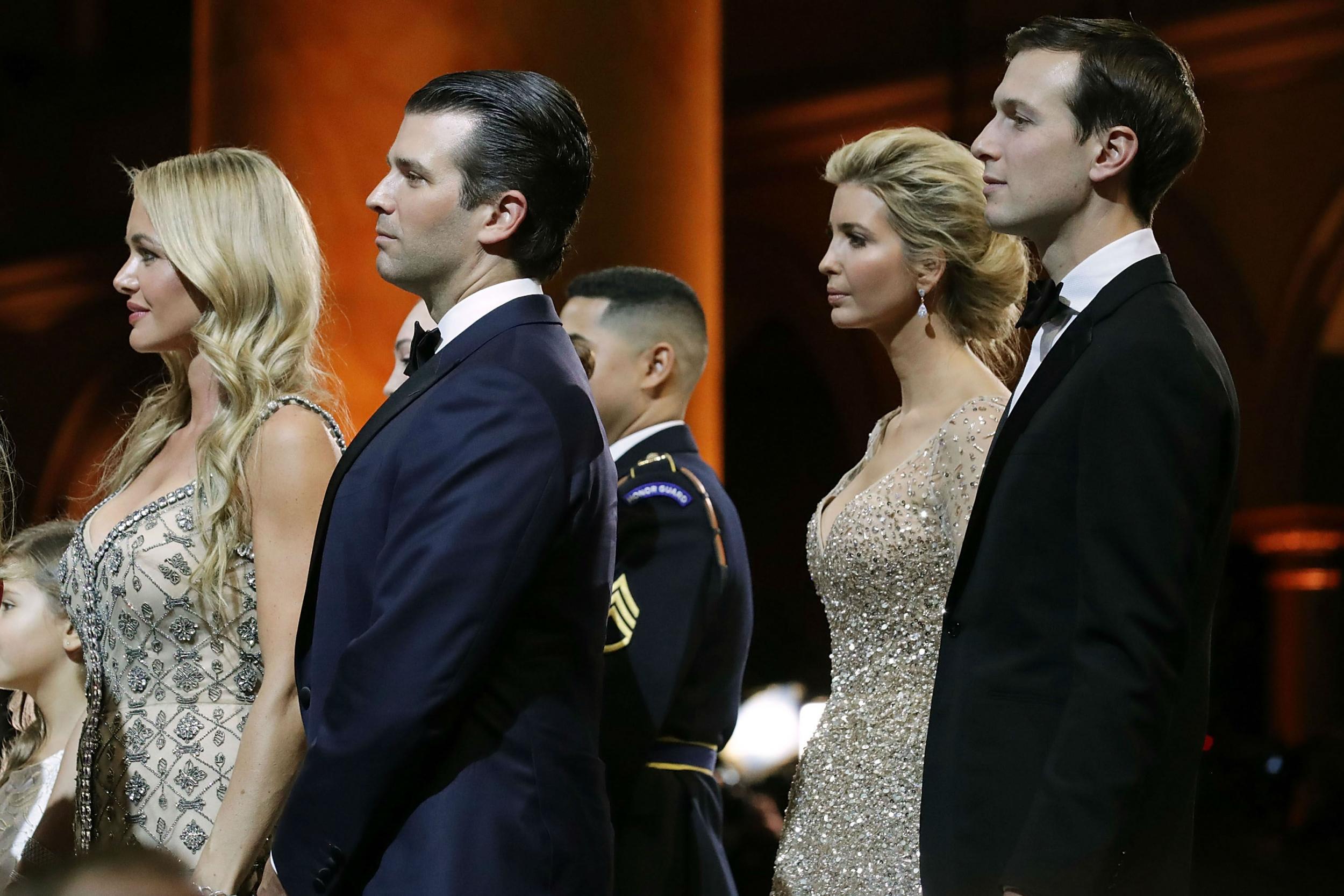 Donald Trump Jr, second left, and Ivanka Trump, second from the right, were being investigated for fraud