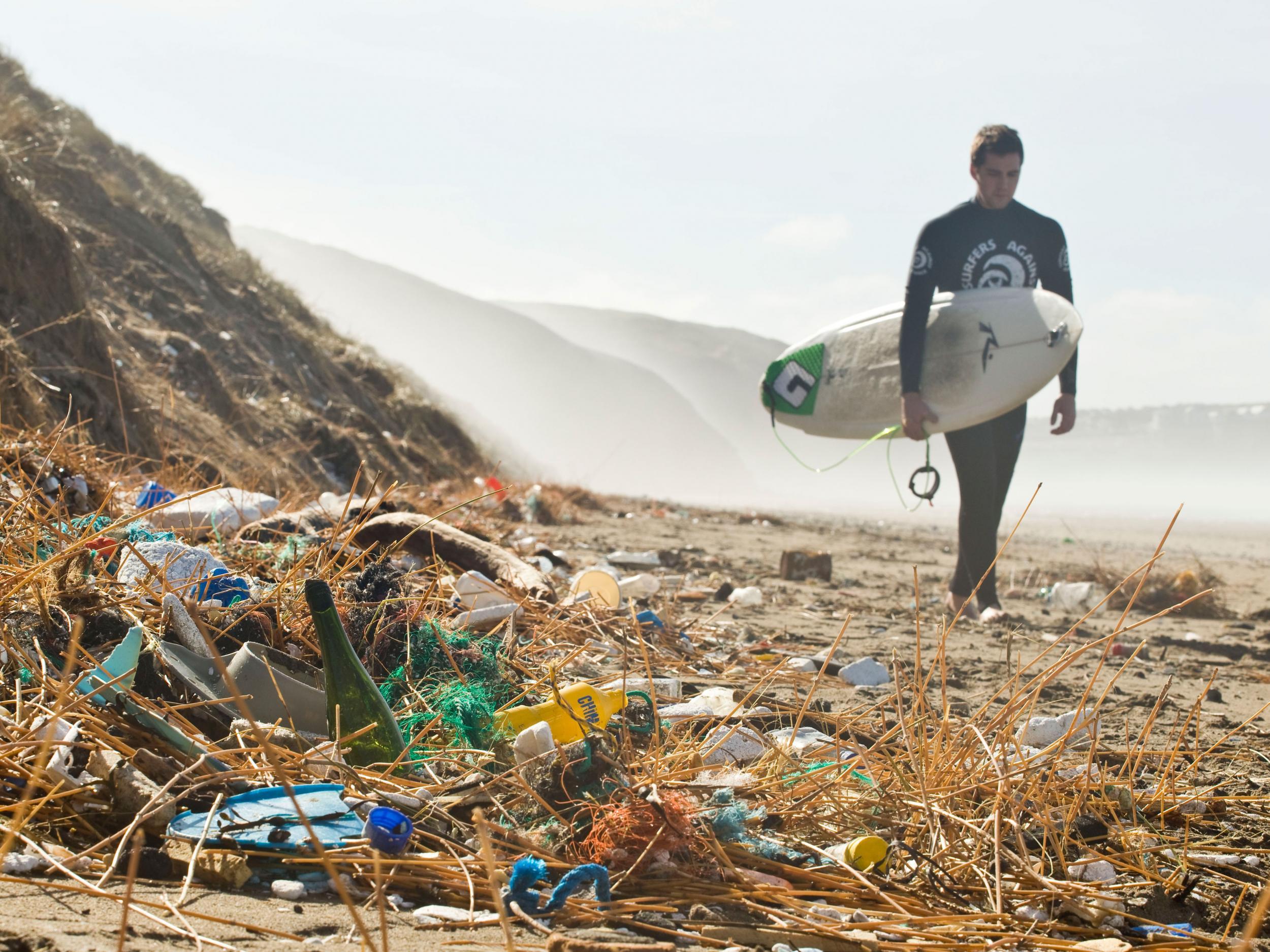 Plastic rubbish strewn along Perranporth beach in Cornwall