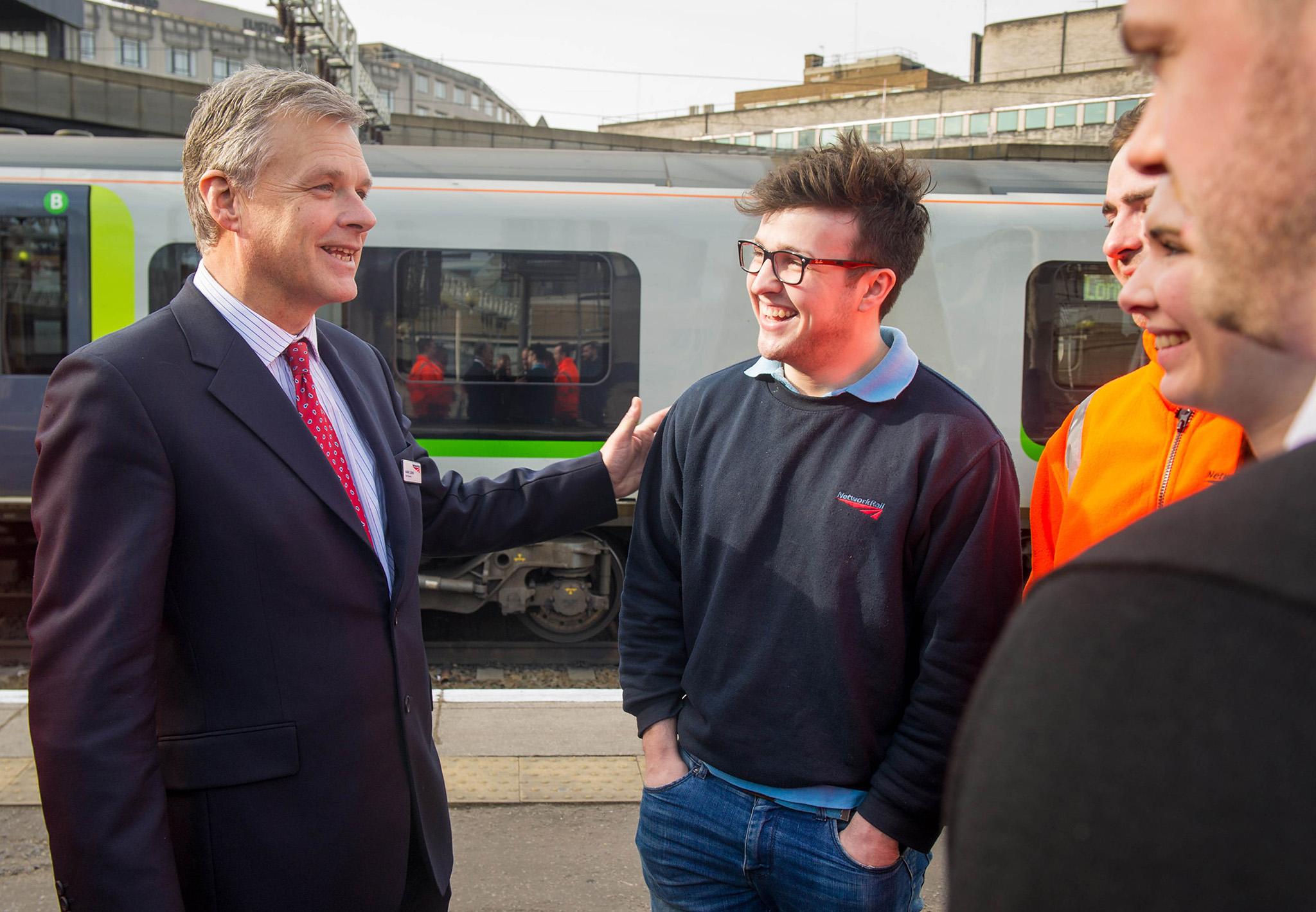 Network Rail chief Mark Carne (left) meets an apprentice. He is set for a salary increase and five figure bonus