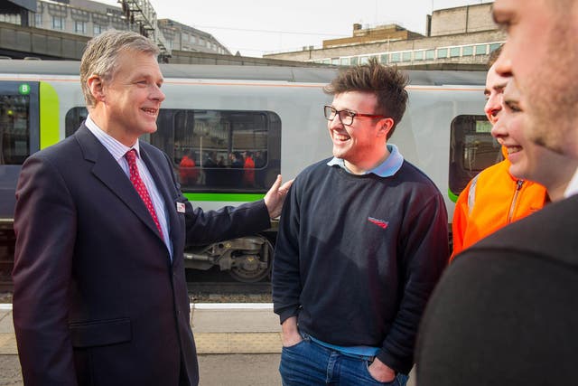 Network Rail chief Mark Carne (left) meets an apprentice. He is set for a salary increase and five figure bonus
